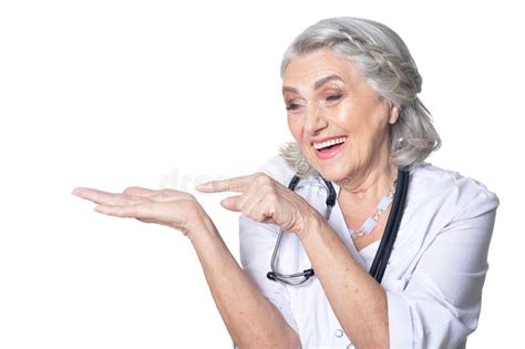 senior female doctor showing something isolated on white background stock image image of