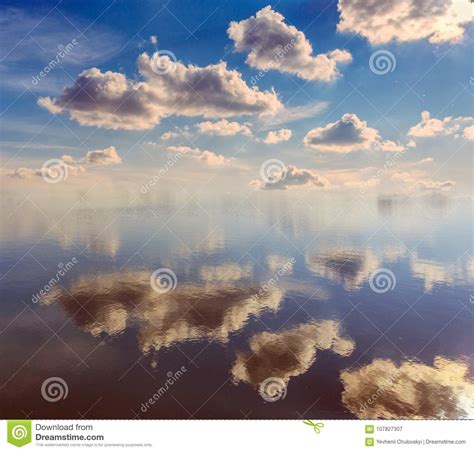Breathtaking Scenery Blue Sky With Perfect Clouds Reflection In Water