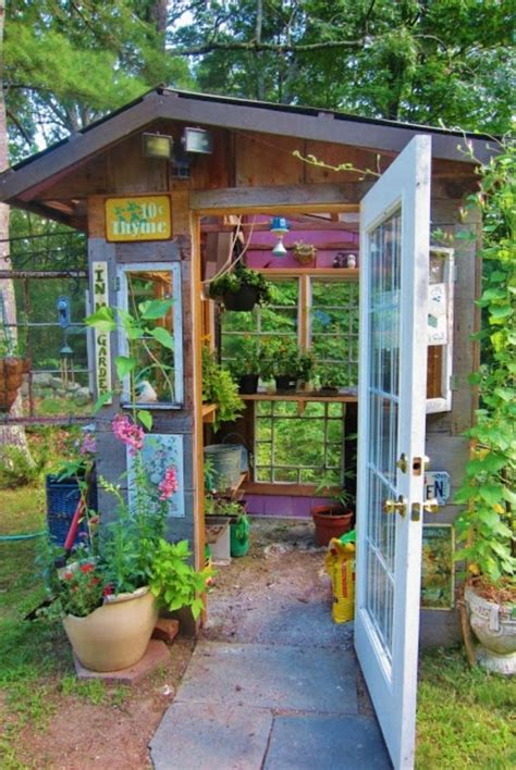 A Small Garden Shed With Lots Of Plants In The Doorway And Potted