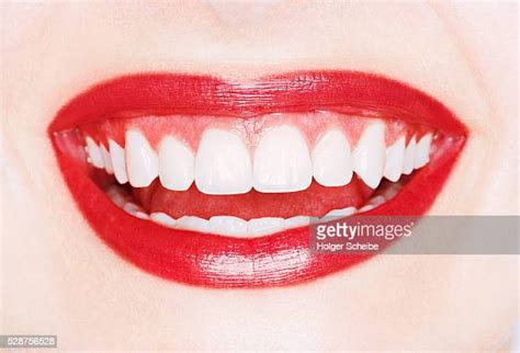 white teeth red lips photos and premium high res pictures getty images