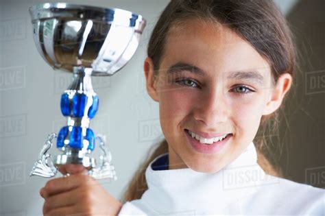 Smiling Girl Holding Fencing Trophy Stock Photo Dissolve