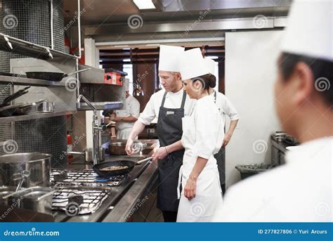 Chef Teamwork And People With Frying Pan In Kitchen Catering Service