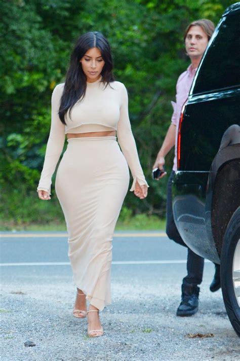 Kim Kardashian Shows Off Famous Curves In Clinging Nude Outfit As She