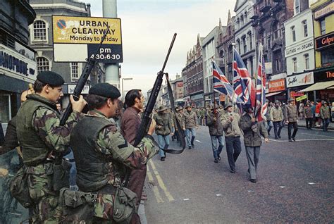 Under The Watchful Eyes Of Armed British Troops Members Of The Ulster