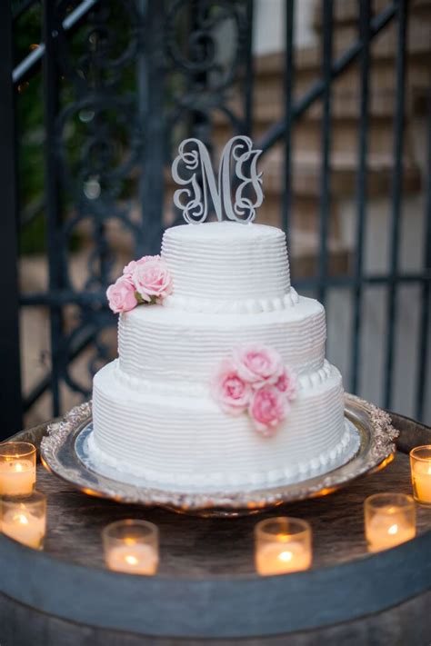 Our tiered cakes come with internal supports to ensure they stay stacked. Three-Tier White Wedding Cake