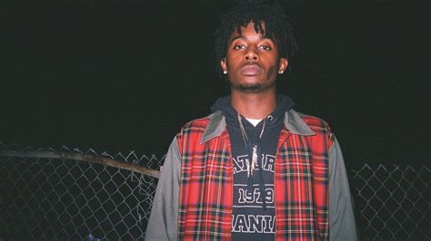 Playboi Carti Is Wearing Red Striped Coat Standing In