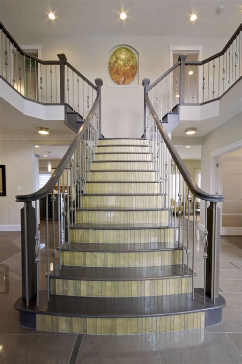 The Stairs Are Made Of Glass And Have Metal Balustiers On Each Handrail