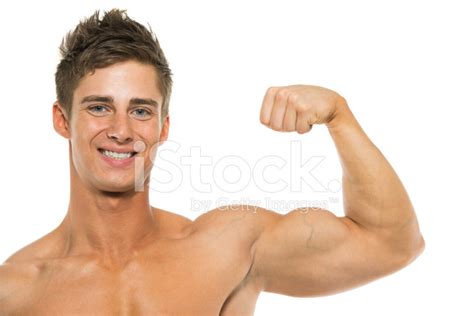 Smiling Muscular Man Flexing His Biceps Stock Photos