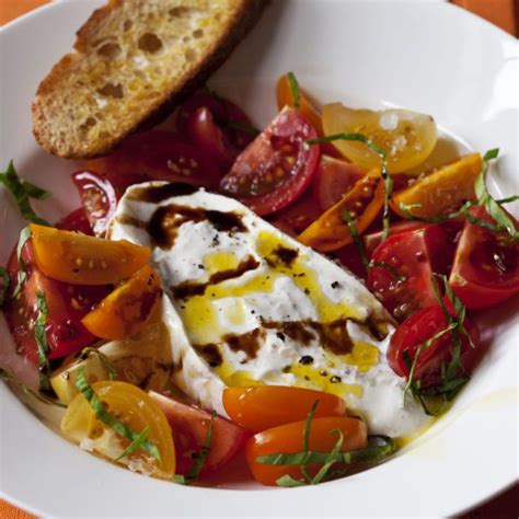 Once the bread is grilled and drizzled with olive oil, spread the pesto on top, add a few pieces of thinly cut salami, some buffalo mozzarella. Tomatoes & Burrata | Recipe (With images) | Barefoot ...