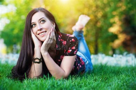 Happy Pretty Girl Laying On The Grass Stock Photo Image Of Brunette