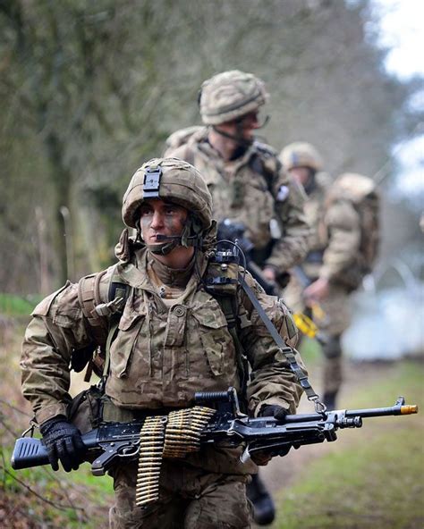 A Royal Marine Of 40 Commando Leads Comrades On A Patrol Of South West