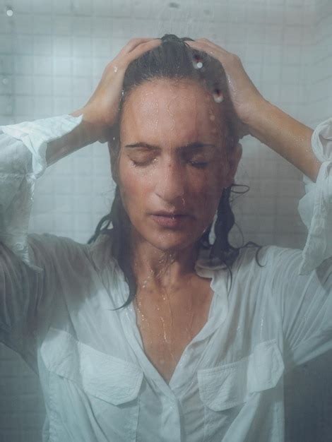 Premium Photo Seductive Female In Wet Shirt In Shower Cabin
