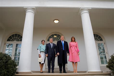Iván duque márquez (spanish pronunciation: Melania Stuns In Hot Pink Plaid Coat During Greeting Of ...