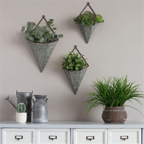 Metal signs or heavy wooden wall signs may need extra support to stay in place. Stratton Home Decor 3-Piece Triangular Galvanized Metal Wall Planters-S09553 - The Home Depot ...