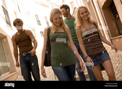 Two Couples Walking Outdoors Stock Photo Alamy