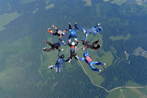 A Group Of Skydivers Above White Big Cloud Stock Image Image Of