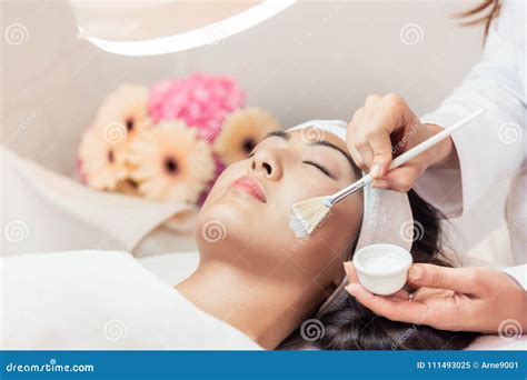 Close Up Of The Face Of A Beautiful Woman Relaxing During Rejuvenating Massage Stock Image
