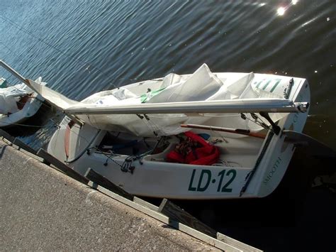 Scow — a scow, in the original sense, is a flat bottomed boat with a blunt bow, often used to haul garbage or similar bulk freight; 1990 Melges C-Scow sailboat for sale in Iowa