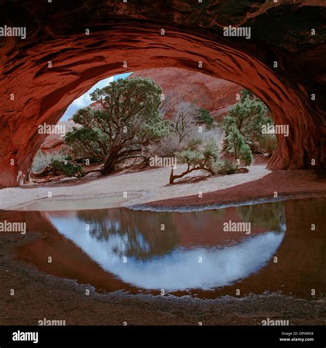 Navajo Arch Reflection Stock Photo Alamy
