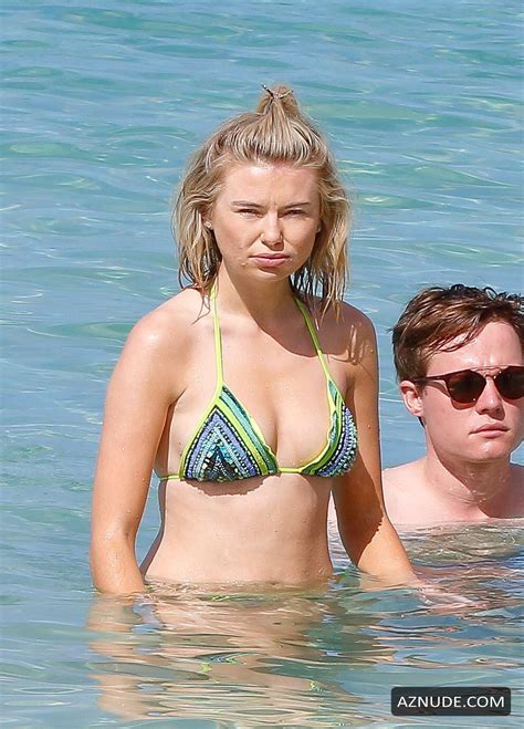 georgia toffolo spotted on the beach in a tiny green bikini while on holiday in barbados aznude