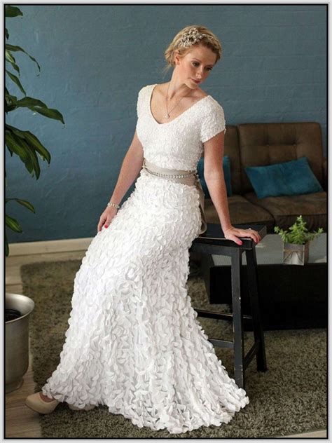 If you love colors and wanna integrate them into your bridal look a simple yet very romantic off the shoulder wedding dress with a train for a boho feel. Wedding Dress For Women Over 40