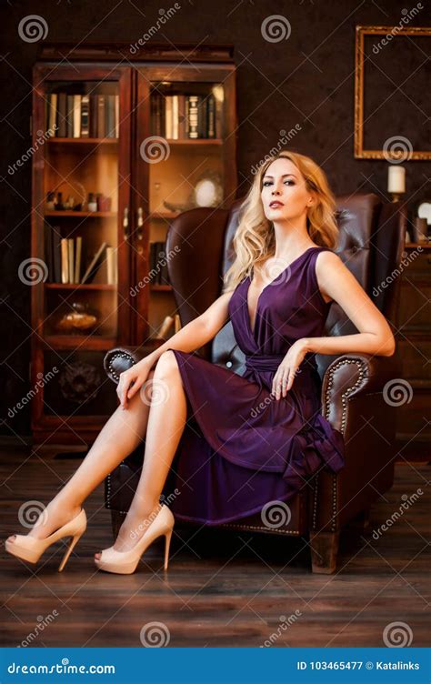 Woman In Beautiful Dress Sits In Luxury Leather Chair Stock Image Image Of Dress Fashionable