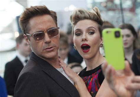 Robert Downey Jr And Scarlett Johansson Pose For Fan Red Carpet At