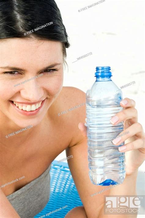 Woman Drinking Water On Beach Stock Photo Picture And Royalty Free Image Pic WR