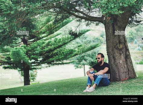 Sitting Under Tree Hi Res Stock Photography And Images Alamy