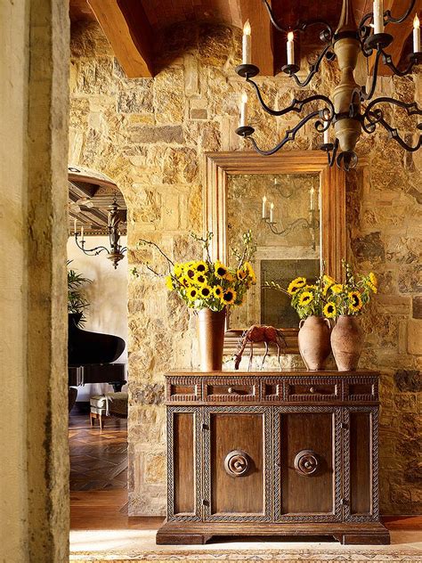Stone Walls And Custom Decor Give The Entry A Tuscan