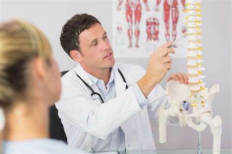 Chiropractor Explaining The Spine Benefits Of Chiropractic Care Chiropractic Center