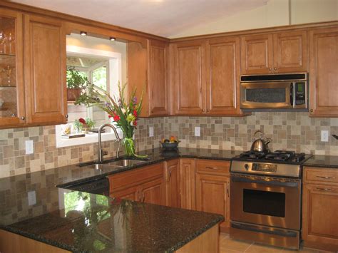 Open kitchen dining room modular design with light maple island and best granite countertops ideas. R & D Kitchen 2009 | Alex Freddi Construction, LLC.