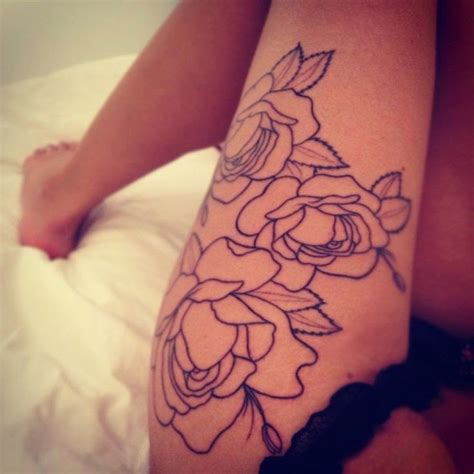Interesting Designed Black Contour Rose Flowers Tattoo On Thigh