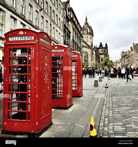 Red Telephone Booths On Sidewalk Stock Photo Alamy