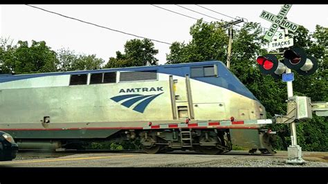 2 Fast Amtrak Trains Pass By Railroad Crossings Youtube