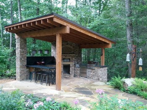 If you have the budget for it, we suggest recreating this here's an idea: Outdoor pizza kitchen in the mountains | Backyard pavilion, Backyard storage sheds, Backyard storage