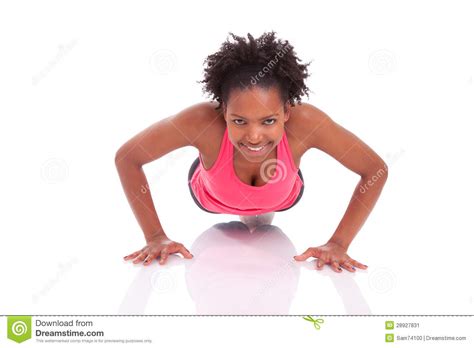 Young Beautiful African Fitness Woman Doing Push Up Exercises On Stock