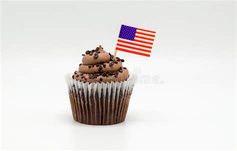 Chocolate Cupcake With An American Flag Toothpick In It Isolated On
