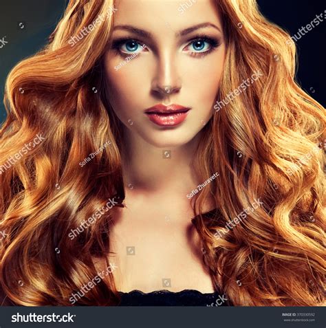 Beautiful Model With Long Curly Red Hair Styling