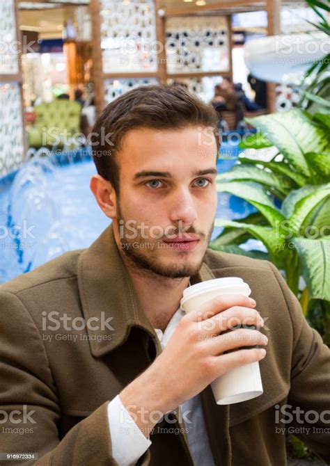 Handsome Young Man Drinking Coffee Stock Photo Download Image Now