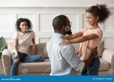 Happy Black Dad And Daughter Hug Reunited After Parting Stock Photo
