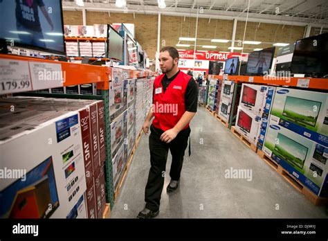 COSTCO employees arrange items in newly open store in Texas Stock Photo
