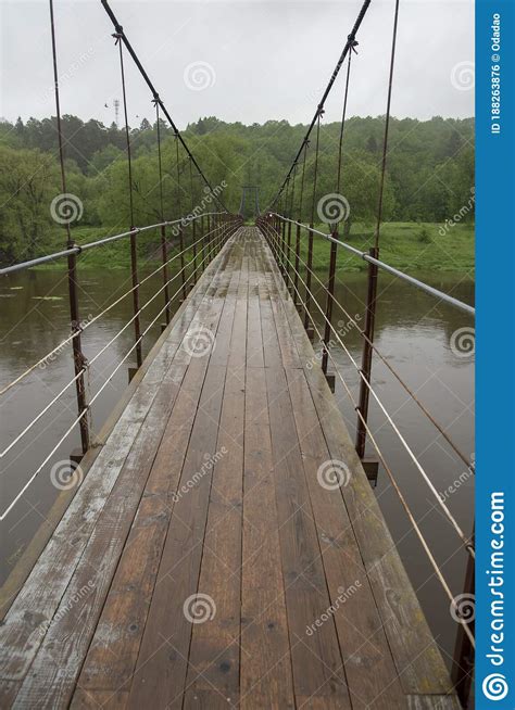 Suspension Bridge Over The River On A Rainy Day Stock Photo Image Of