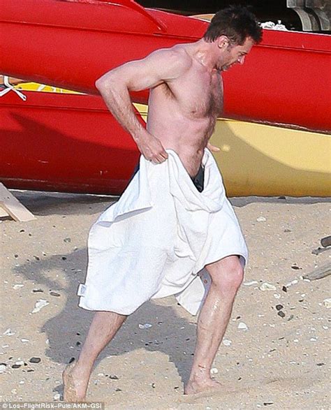 Hugh Jackman Displays Bulging Biceps And Ripped Abs On Hawaiian Holiday