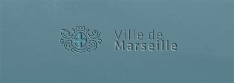The Logo For Villa De Marella Is Shown On A Blue Wall In Front Of A