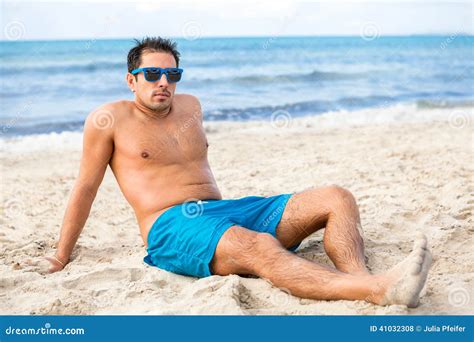 Handsome Man Relaxing On The Beach Stock Photo Image Of Attractive