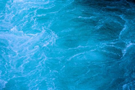 Blue Body Of Water Under Clear Blue Sky · Free Stock Photo