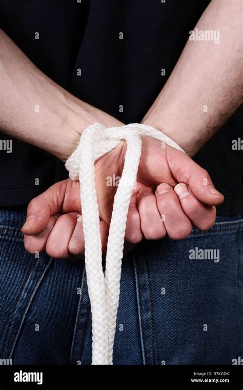 Mans Hands Tied Together Stock Photo Alamy