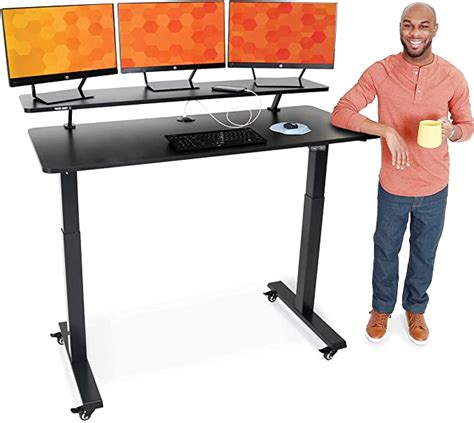stand steady tranzendesk power 55 inch electric standing desk with built in charging height