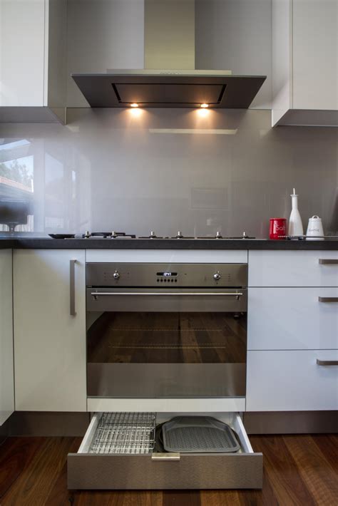 Unfollow kitchen kickboards to stop getting updates on your ebay feed. Exposed rangehood. Kickboard drawer. Glass splashback. www ...